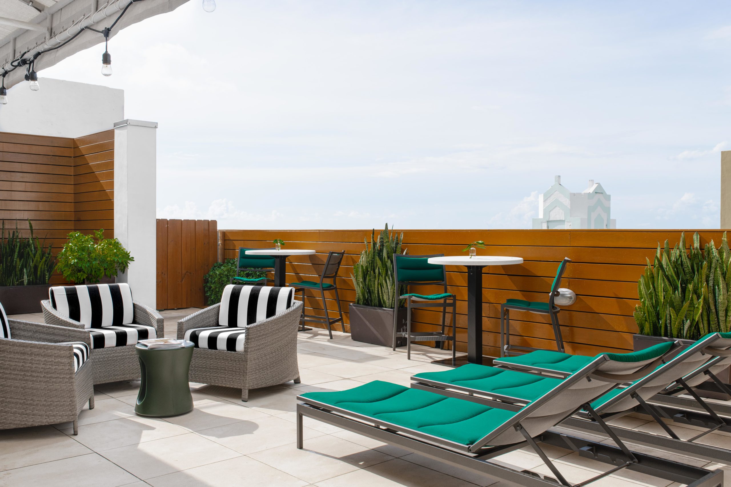 Striped lounge chairs on the rooftop sundeck at Winter Haven Hotel in South Beach